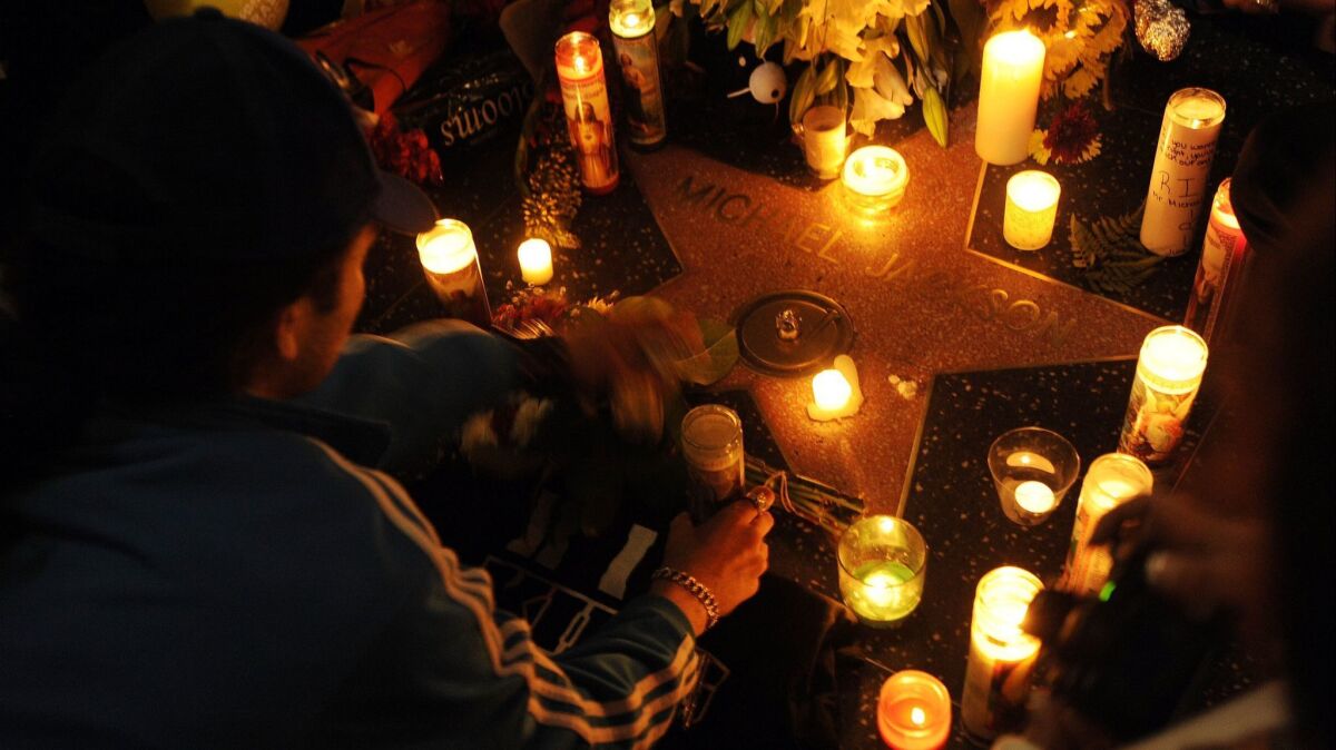 Michael Jackson fans gather around his star on the Hollywood Walk of Fame on June 26, 2009.