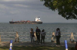 Venezuelans watch oil tankers anchored in Lake Maracaibo