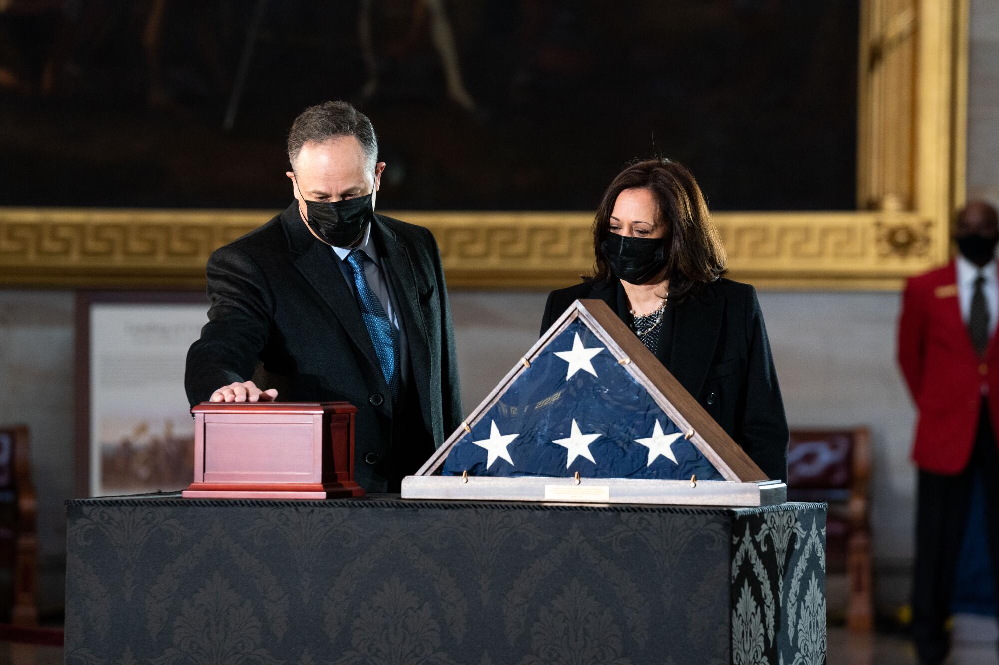 Vice President Kamala Harris and her husband,  Doug Emhoff, pay their respects 