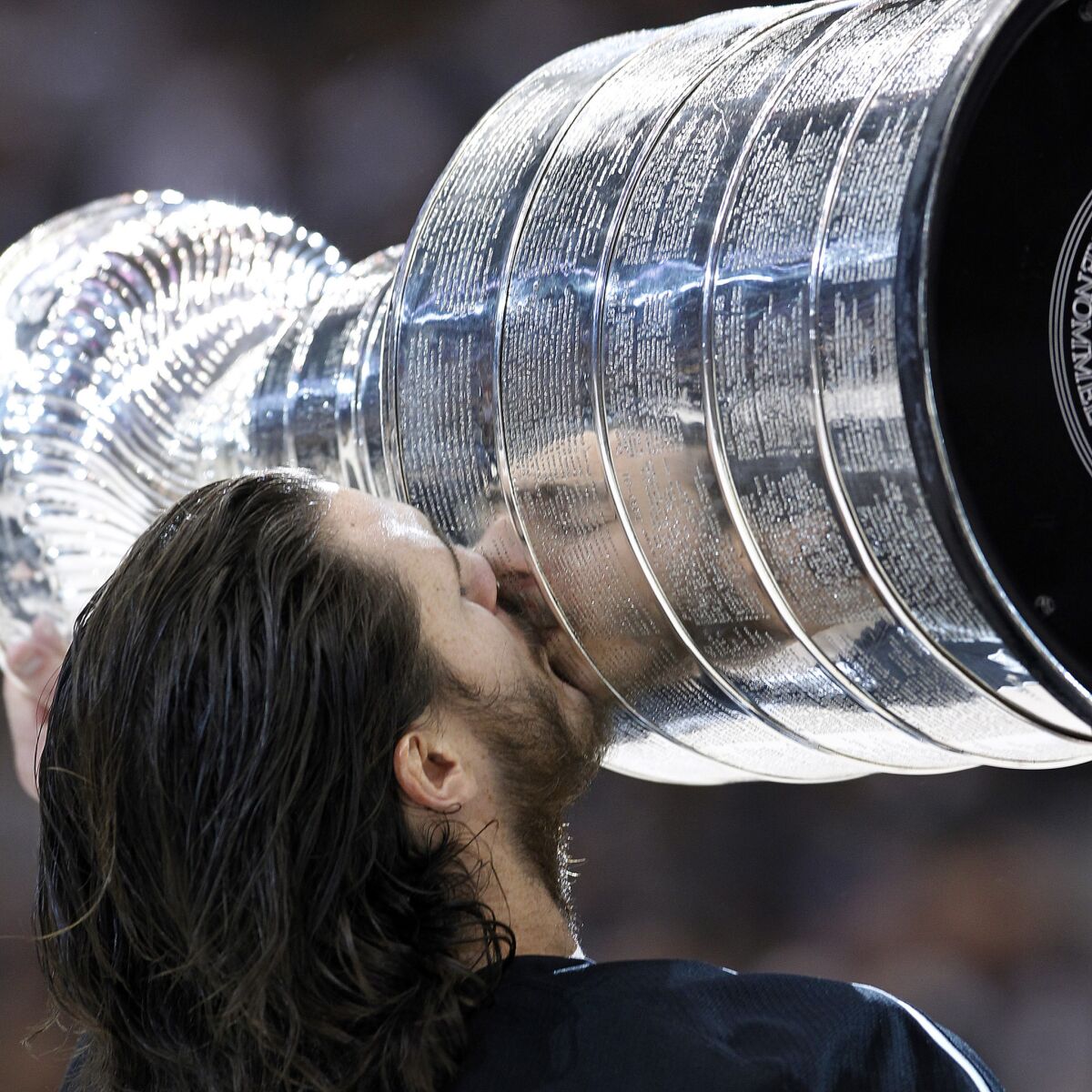 Forward Kevin Westgarth kisses the Stanley Cup after the Kings defeated the Devils, 6–1, to win the 2012 Stanley Cup championship.