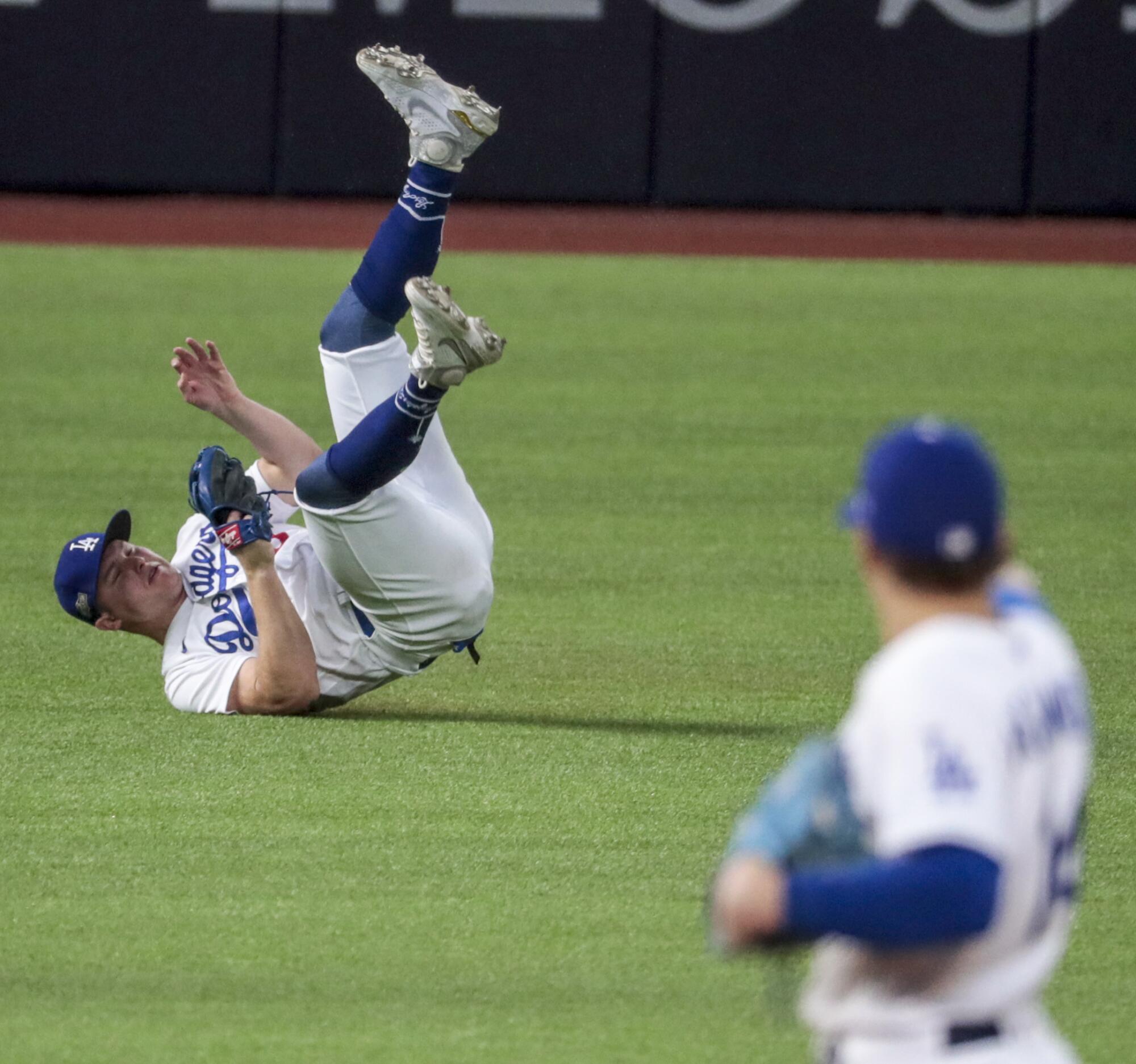  Dodgers left fielder Joc Pederson snags a  liner by Atlanta Braves left fielder Austin Riley  in the ninth inning