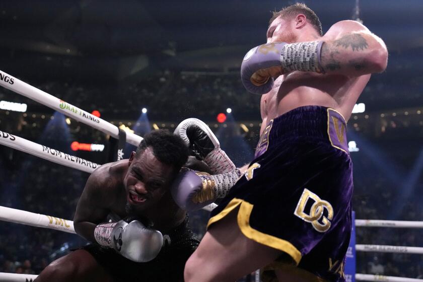 Canelo Alvarez, of Mexico, right, fights Jermell Charlo in a super middleweight title boxing match, Saturday, Sept. 30, 2023, in Las Vegas. (AP Photo/John Locher)