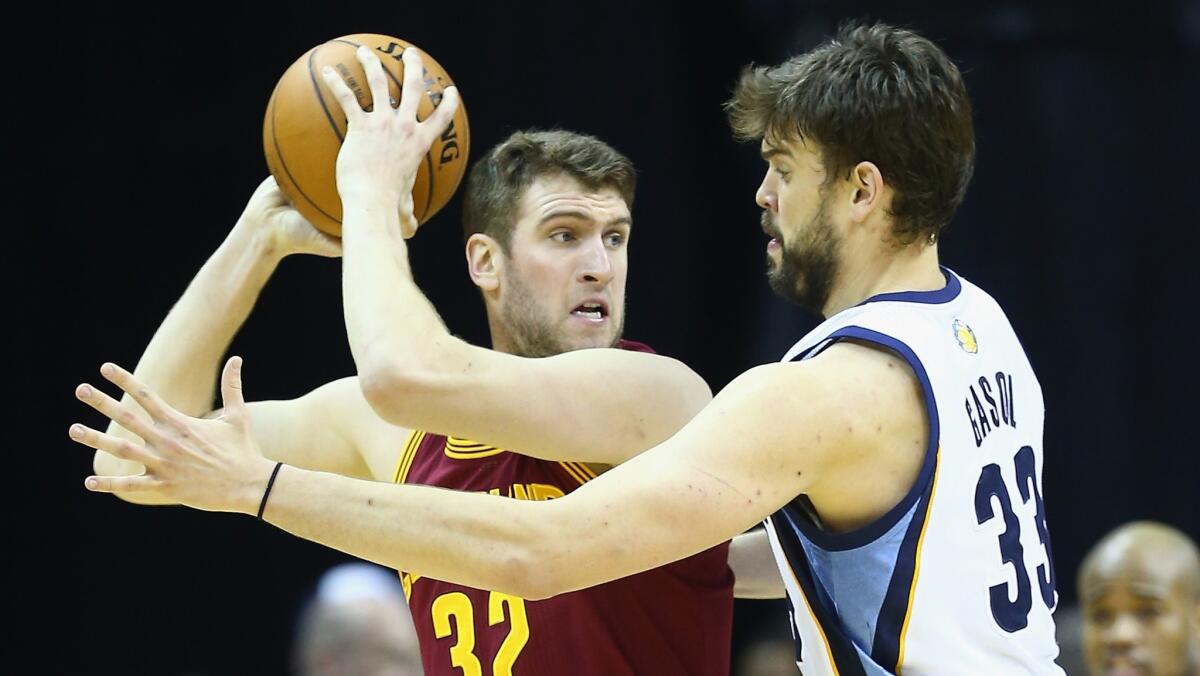 Center Spencer Hawes, who was introduced by the Clippers on Thursday after signing a four-year, $23-million deal, battles with Memphis' Marc Gasol during a game on March 1.