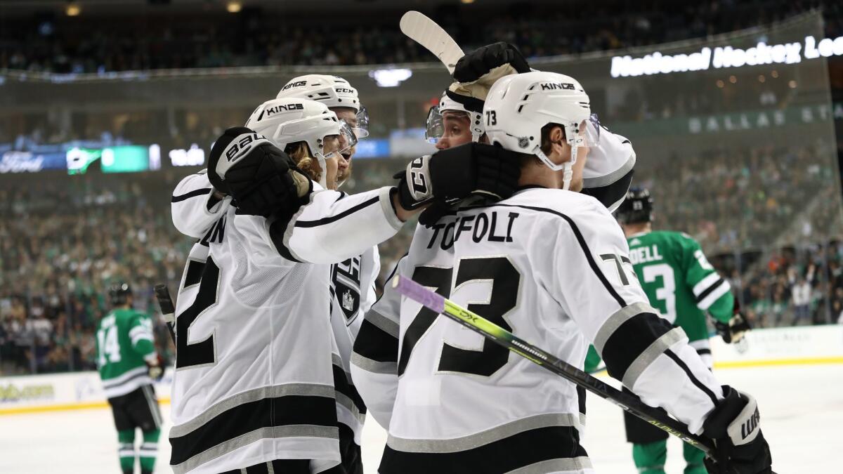 Tyler Toffoli (73) and other Kings celebrate Carl Hagelin's, left, goal against the Dallas Stars during the second period at the American Airlines Center. It was the eventual game-winner.