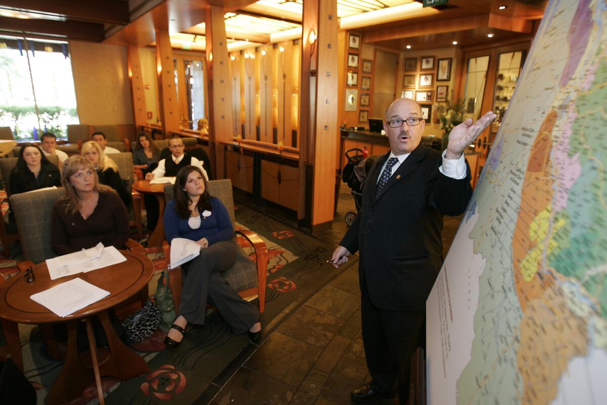 Michael Jordan, right, general manager at Disney's Napa Rose restaurant, leads an orientation class for the members of his staff who are going for their master sommelier certification.