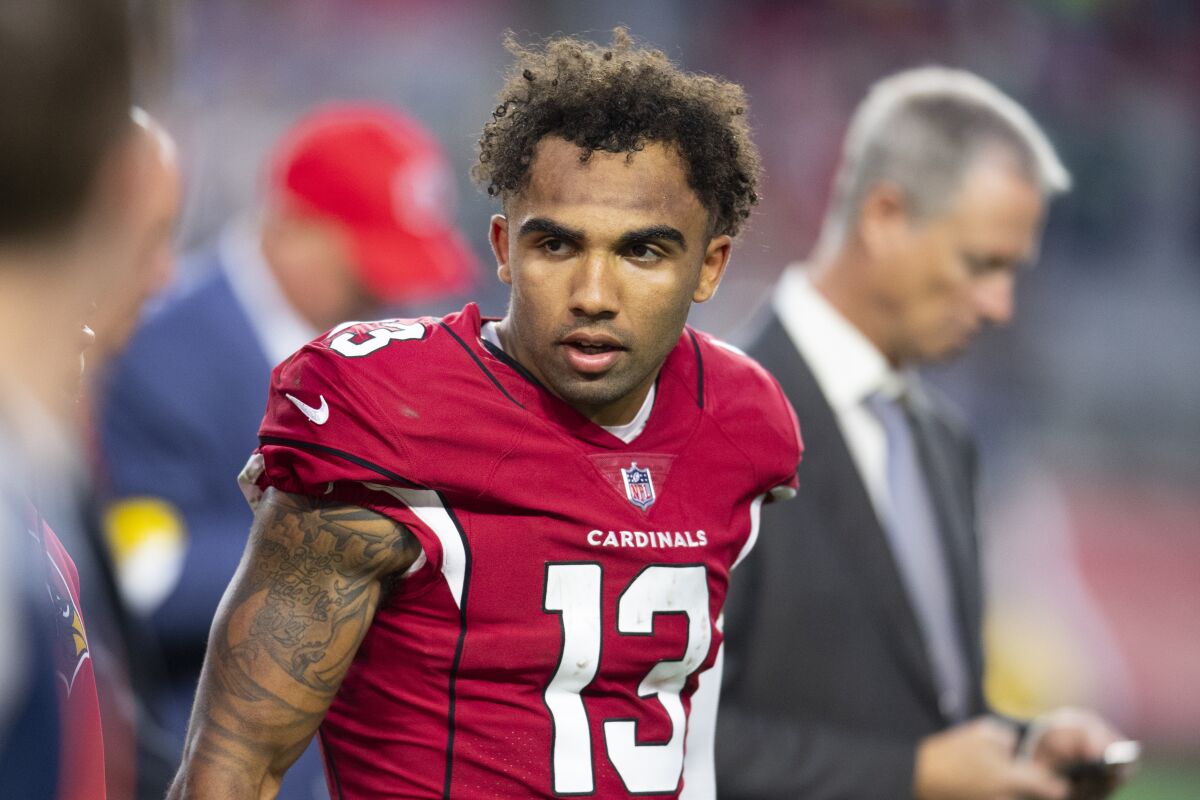 FILE - Arizona Cardinals wide receiver Christian Kirk looks on after playing against the Seattle Seahawks in an NFL football game Jan. 9, 2022, in Phoenix. Kirk signed a four-year, $72 million contract with the Jacksonville Jaguars, Thursday, March 17, 2022, that includes $37 million guaranteed. (AP Photo/John McCoy, File)