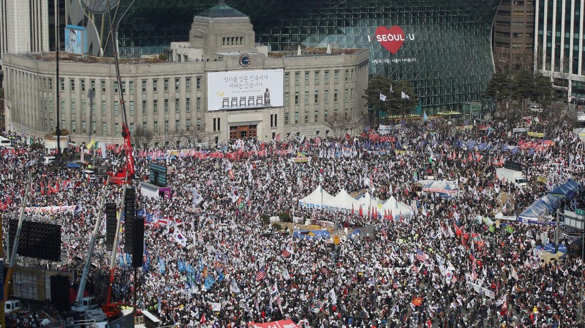 Thousands of South Koreans rally March 4 in Seoul in support of embattled President Park Geun-hye. A court is expected to rule this week on whether she should be removed from office.