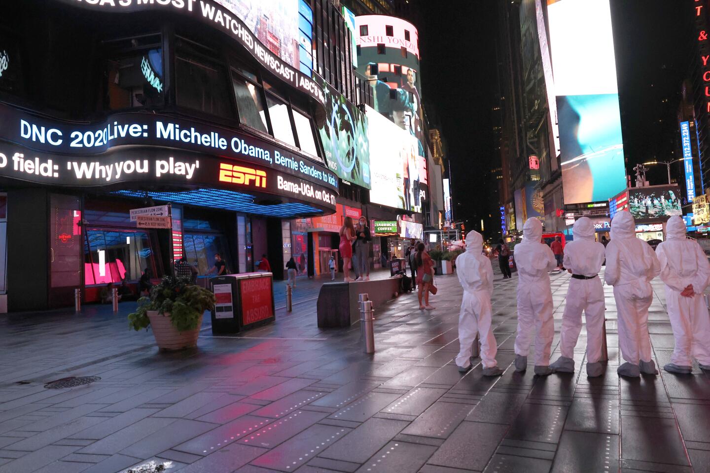 An announcement for the Democratic National Convention is displayed on digital billboards in New York.