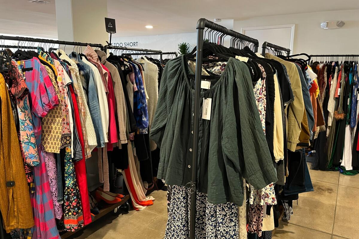 stacks of clothes at reDress second-hand clothing store 