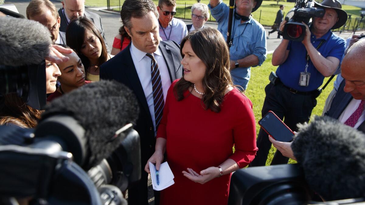 White House Press Secretary Sarah Huckabee Sanders talks to reporters outside the White House on May 3.