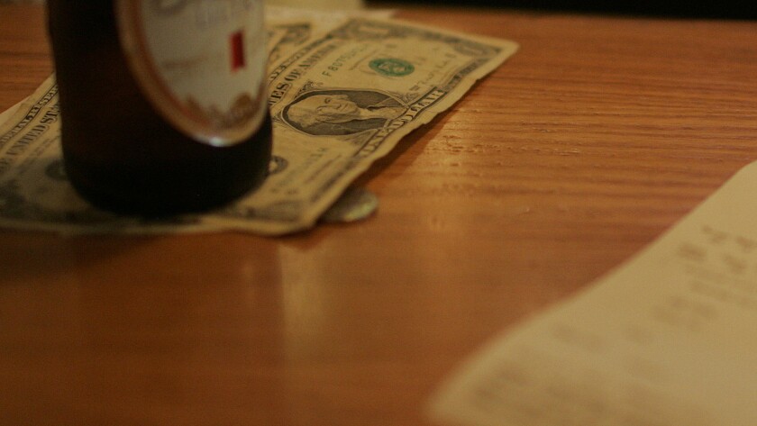 A tip left on a restaurant table.