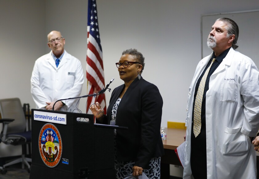Dr. Wilma Wooten, San Diego County's public health officer, spoke at a press conference March as other doctors listened.