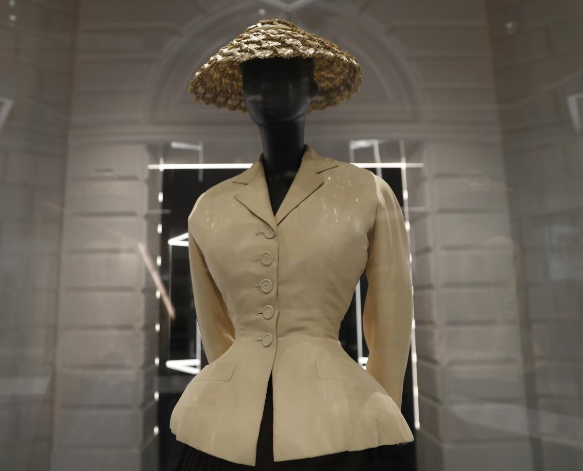 A bar suit and hat designed by Christian Dior in 1947. It's part of an exhibit at the V&A Museum in London.