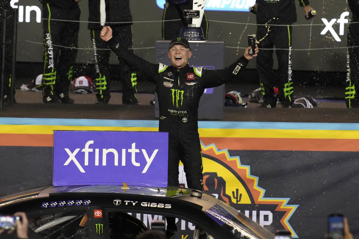 Ty Gibbs celebrates after winning the NASCAR Xfinity Series auto race and the season championship Saturday, Nov. 5, 2022, in Avondale, Ariz. (AP Photo/Rick Scuteri)