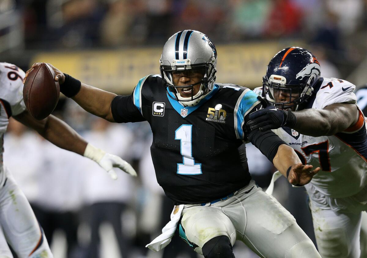 Panthers quarterback Cam Newton (1) is brought down by Broncos defensive end Malik Jackson during the fourth quarter.