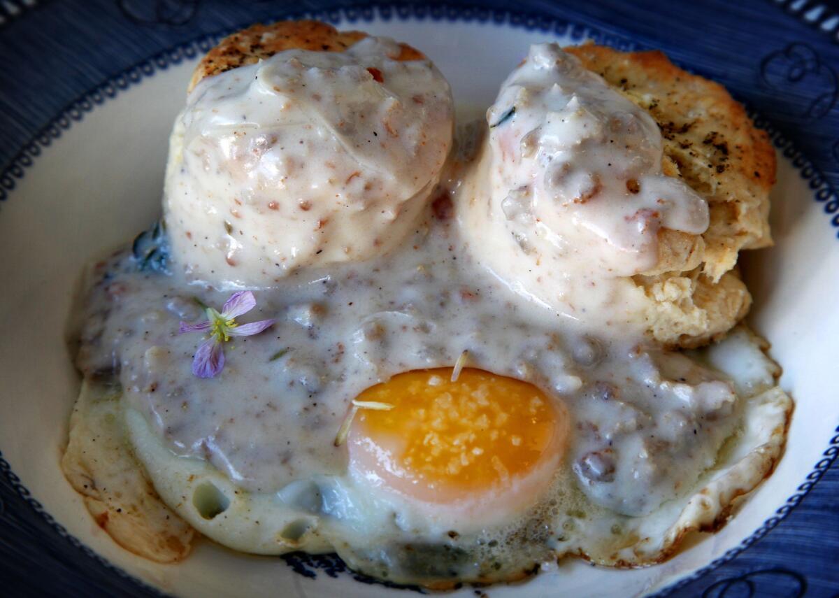 A breakfast treat, freshly baked biscuits and gravy over a poached egg at Sqirl Cafe.