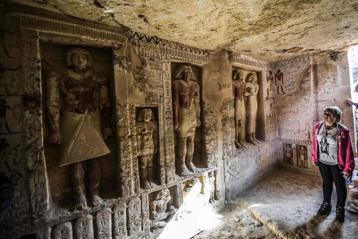 Guests enter the tomb of the high priest Wahtye at the Saqqara necropolis Saturday.