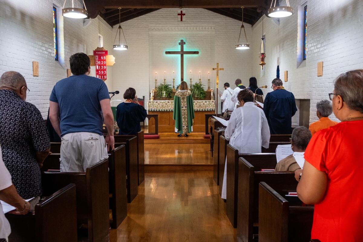 People participate in a service at St. Barnabas Episcopal Church in Pasadena. 