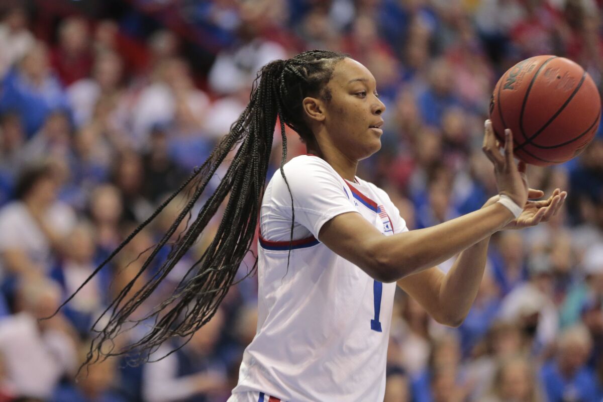 Kansas center Taiyanna Jackson passes the ball after a rebound against Columbia during the first half of an NCAA college basketball game for the WNIT championship Saturday, April 1, 2023, in Lawrence, Kan. (Evert Nelson/The Topeka Capital-Journal via AP)