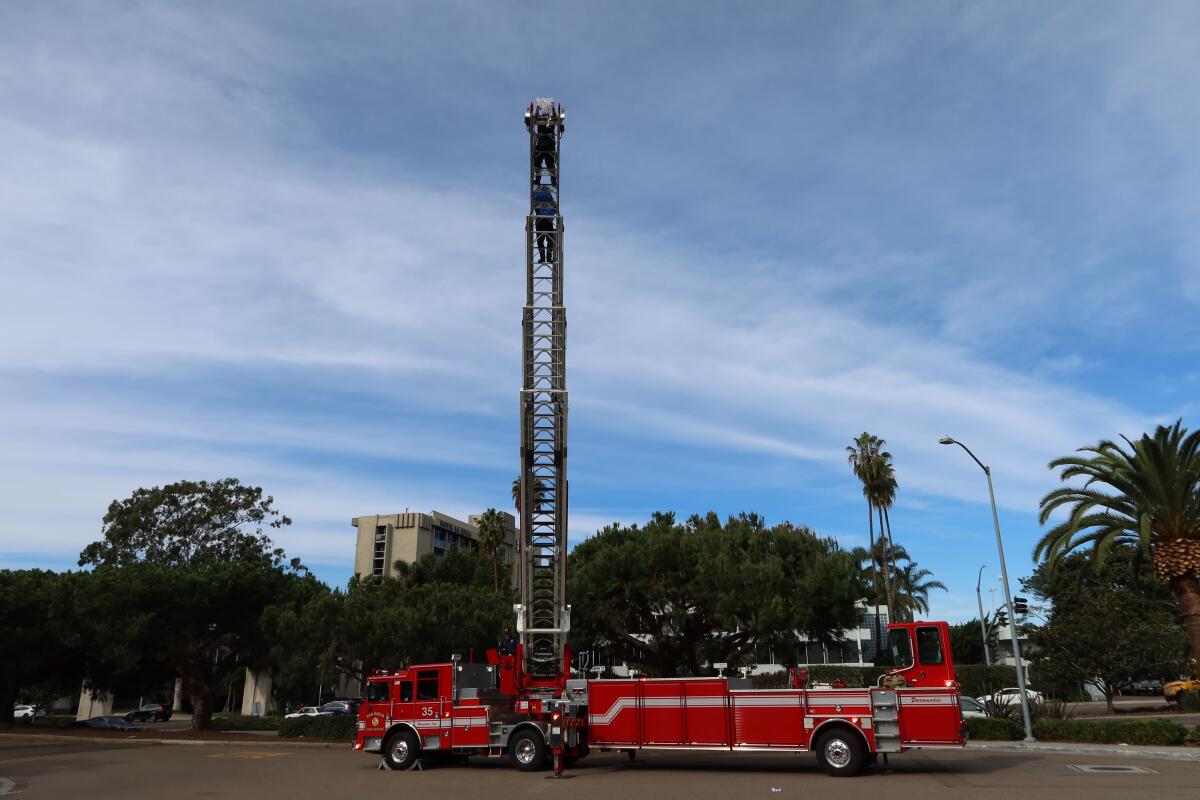 Firefighters in La Jolla help fourth-graders at The Children's School with their "Egg Drop Challenge" on Nov. 17. 