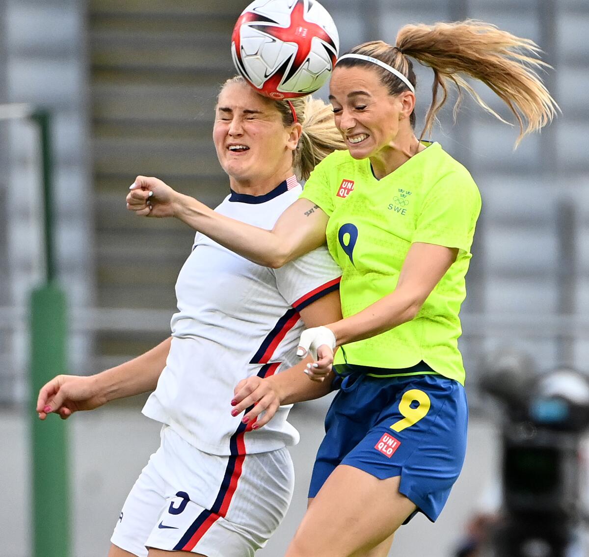 USA's Lindsey Horan battles for the ball with Sweden's Kosovare Asllani.