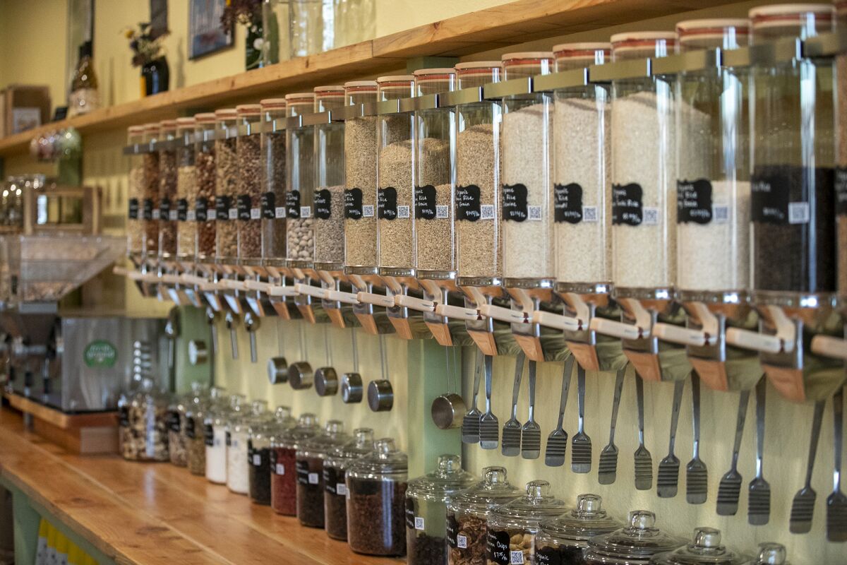 A line of dry goods and pantry staples at Amis de la Terre lets customers buy groceries in a plastic-free environment.
