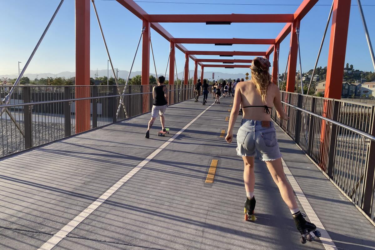 Skaters on a bridge over the L.A. River