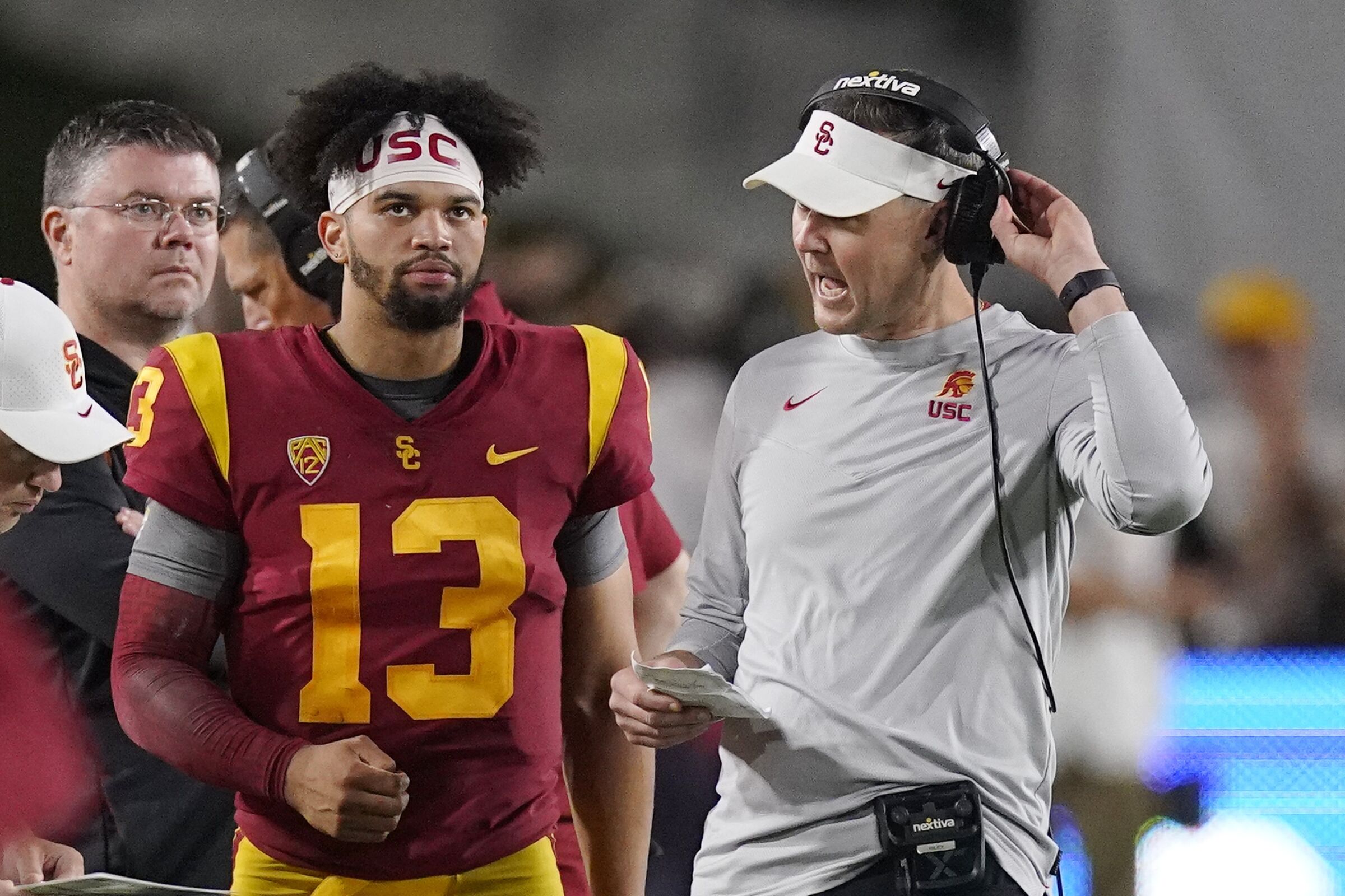USC quarterback Caleb Williams, left, speaks with Lincoln Riley during a game against Arizona State on Oct. 1.