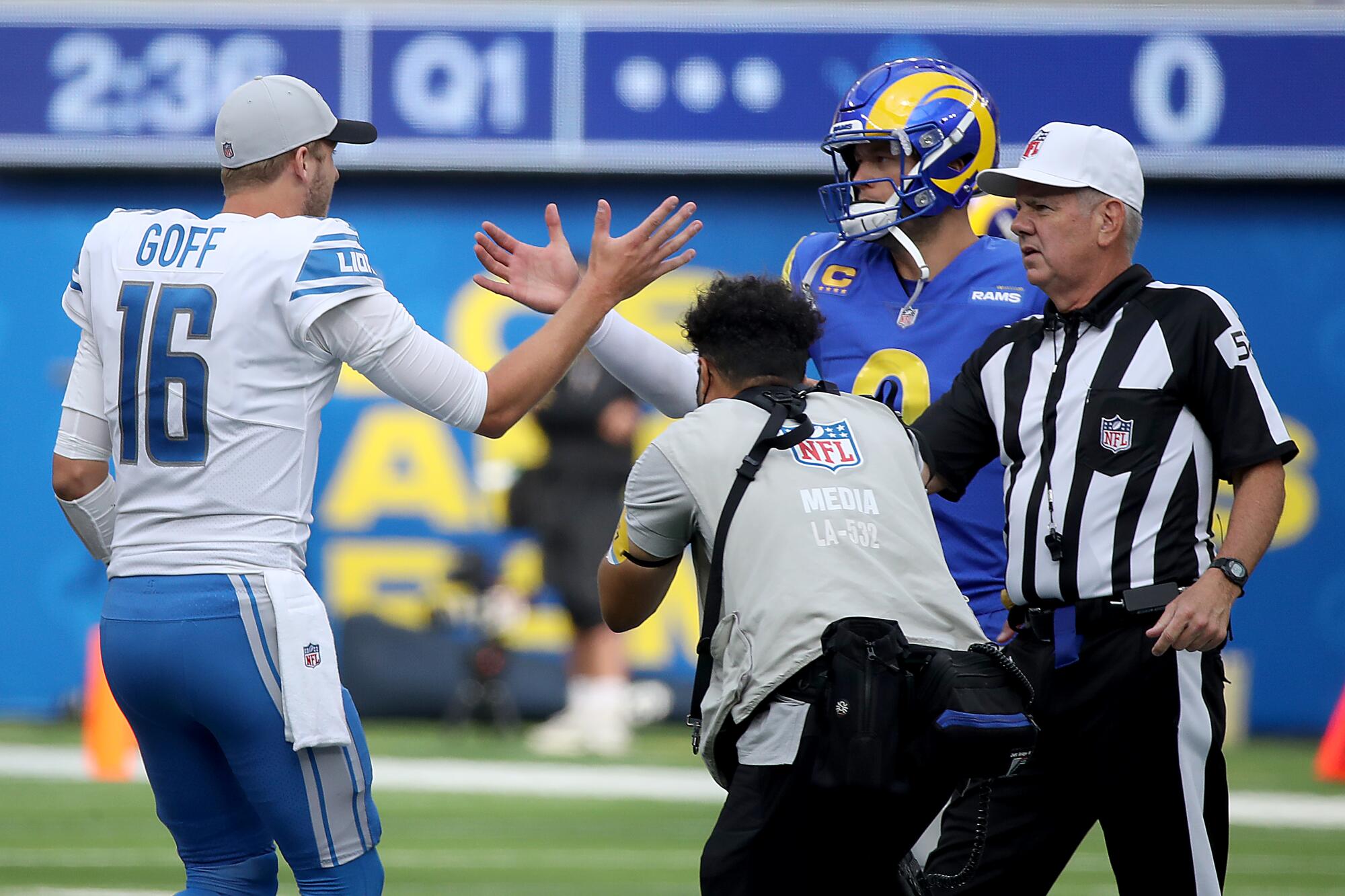 Lions quarterback Jared Goff, left, meets Rams quarterback Matt Stafford.