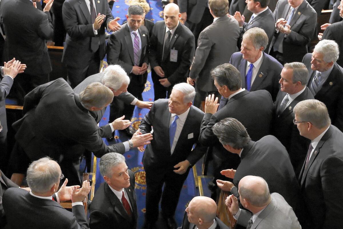 Israeli Prime Minister Benjamin Netanyahu shakes hands as he leaves the House chamber on Capitol Hill after addressing a joint meeting of Congress on Tuesday.