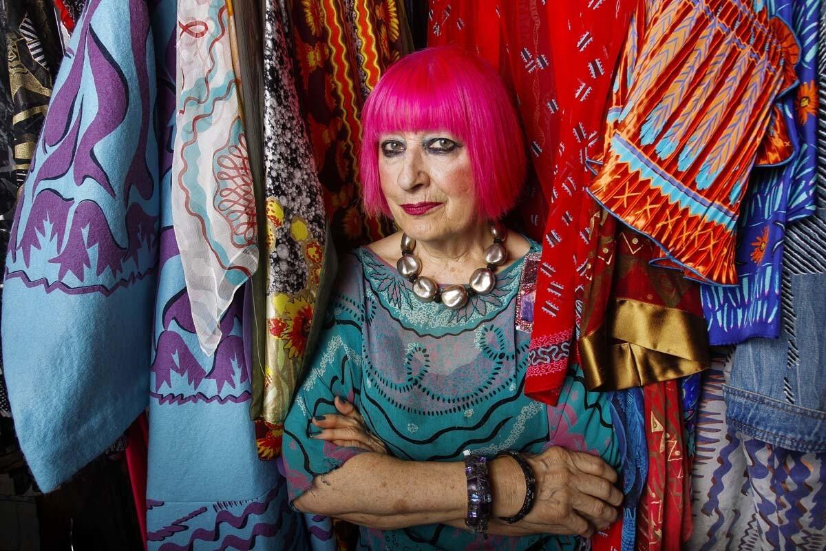 Internationally-known designer Zandra Rhodes among her clothes at her studio in Solana Beach on Friday. (Hayne Palmour IV Union-Tribune)