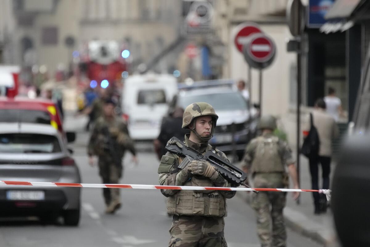 French soldier in cordoned-off area of Paris street