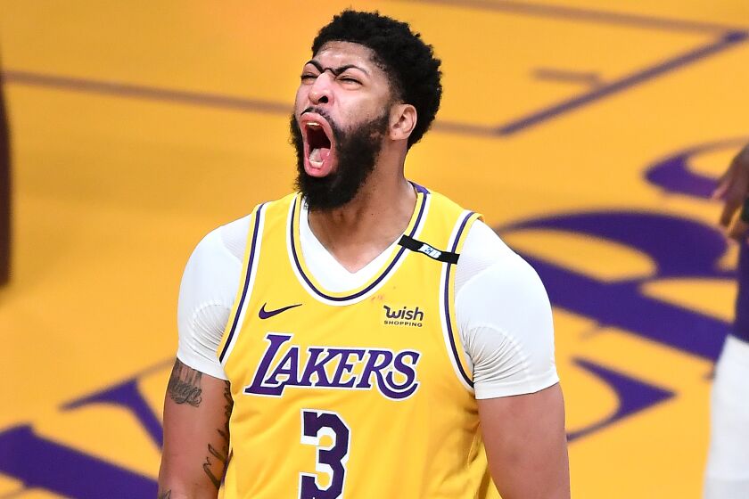 Lakers forward Anthony Davis celebrates his basket after being fouled by a Suns player during Game 3.