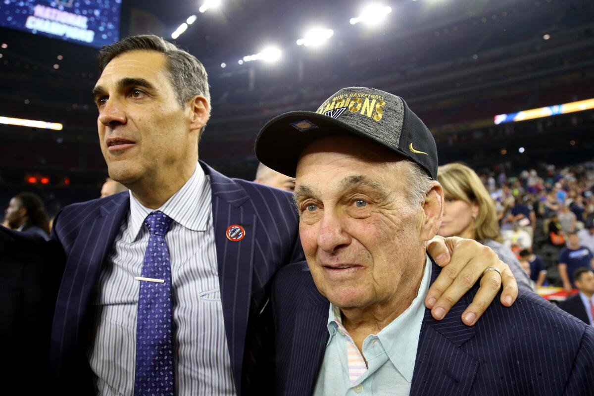 Villanova Coach Jay Wright, left, celebrates with former Wildcats Coach Rollie Massimino after winning the school's first national championship since 1985.