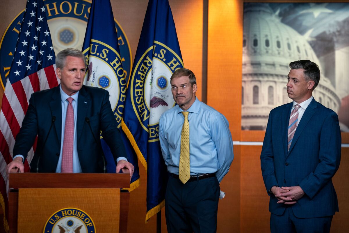 House Republican leader Kevin McCarthy speaks at a news conference with Reps. Jim Jordan, center, and Jim Banks. 