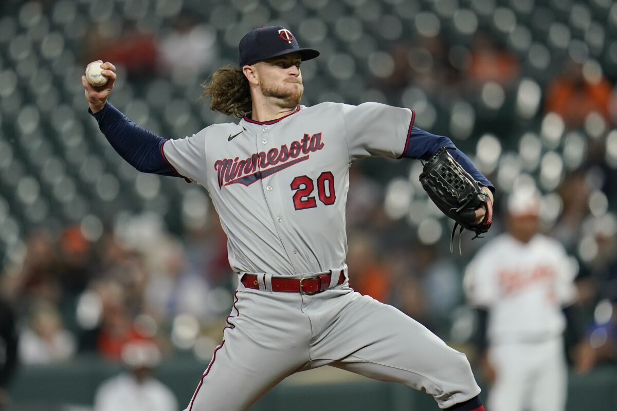 Minnesota Twins starting pitcher Chris Paddack throws a pitch to the against the Baltimore Orioles during the fourth inning of a baseball game, Monday, May 2, 2022, in Baltimore. (AP Photo/Julio Cortez)
