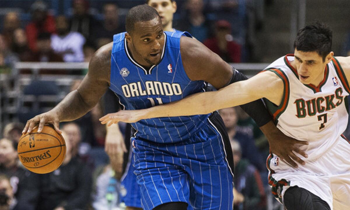 Orlando's Glen Davis, left, steals the ball away from Milwaukee's Ersan Ilyasova during a game on Tuesday. Davis is set to join the Clippers' roster.