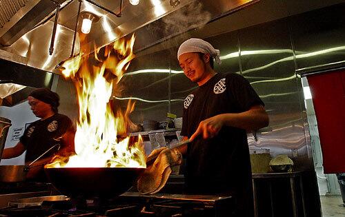 Chief executive chef Natsuki Ishijima prepares a bowl of ramen at Mottainai Ramen restaurant in Gardena.