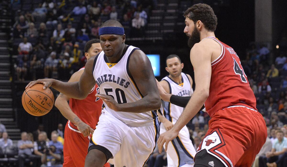 Memphis Grizzlies forward Zach Randolph, left, drives against Chicago Bulls forward Nikola Mirotic during the second half of a game on Tuesday.