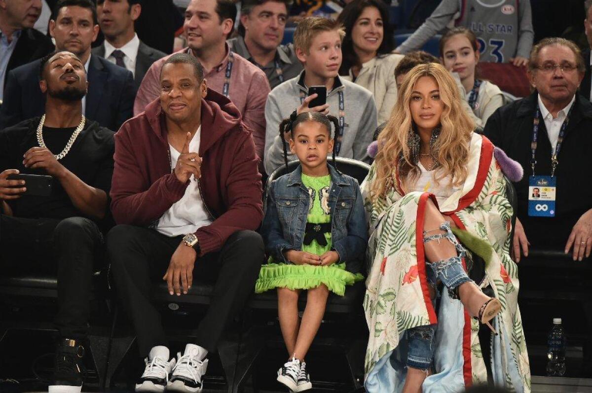 Blue Ivy Carter, between father Jay Z and mother Beyoncé in February, features on a new track by Jay Z.
