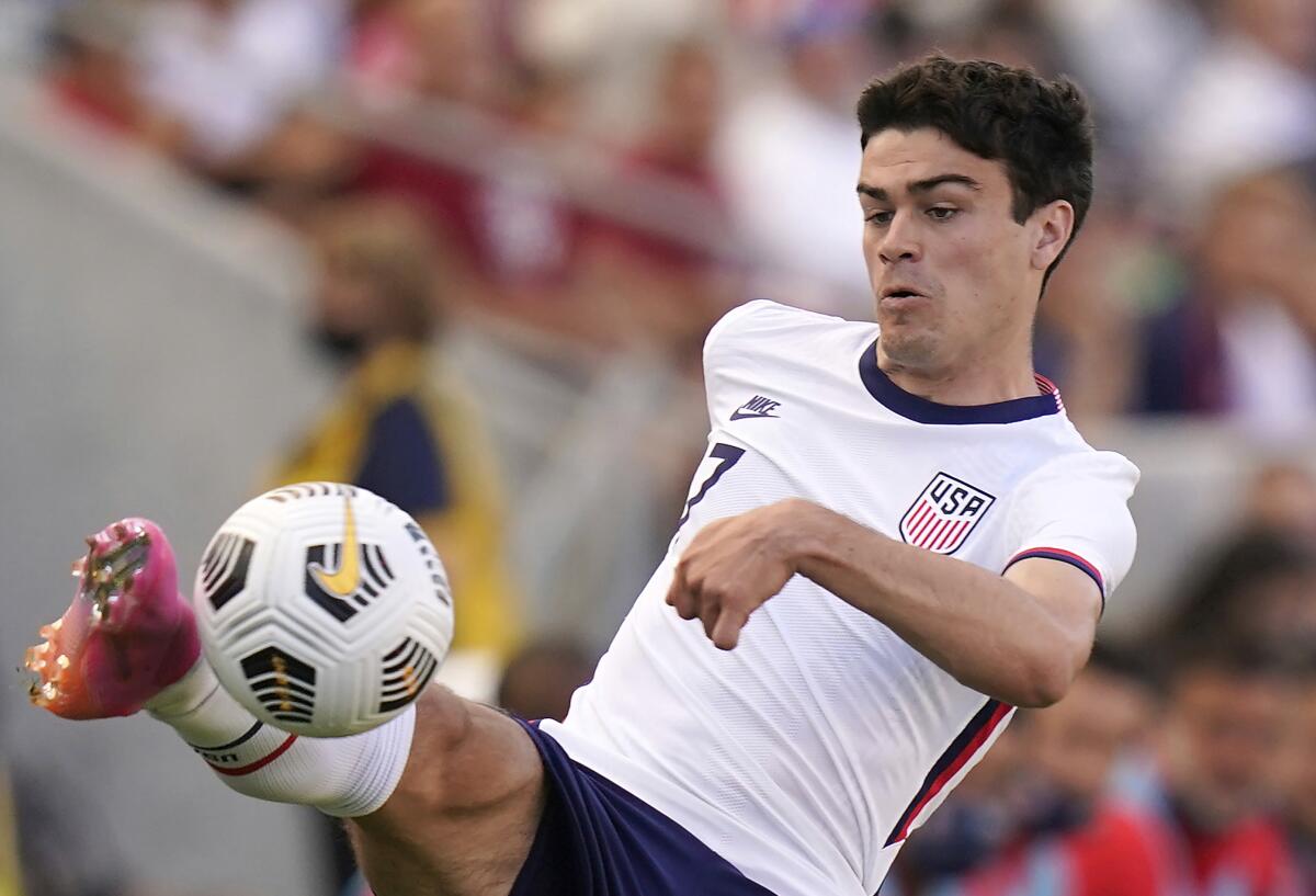 American Gio Reyna controls the ball during a 2021 match against Costa Rica 