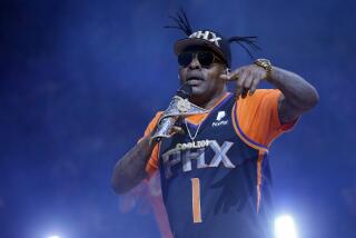 FILE - Coolio performs at halftime of an NBA basketball game between the Phoenix Suns and the New Orleans Pelicans on April 5, 2019, in Phoenix. Coolio, the rapper who was among hip-hop's biggest names of the 1990s with hits including “Gangsta's Paradise” and “Fantastic Voyage,” died Wednesday, Sept. 28, 2022, at age 59, his manager said. (AP Photo/Rick Scuteri, File)