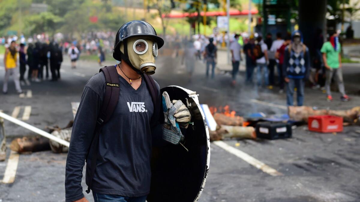 Anti-government activists set up barricades in Caracas during the Sunday election.