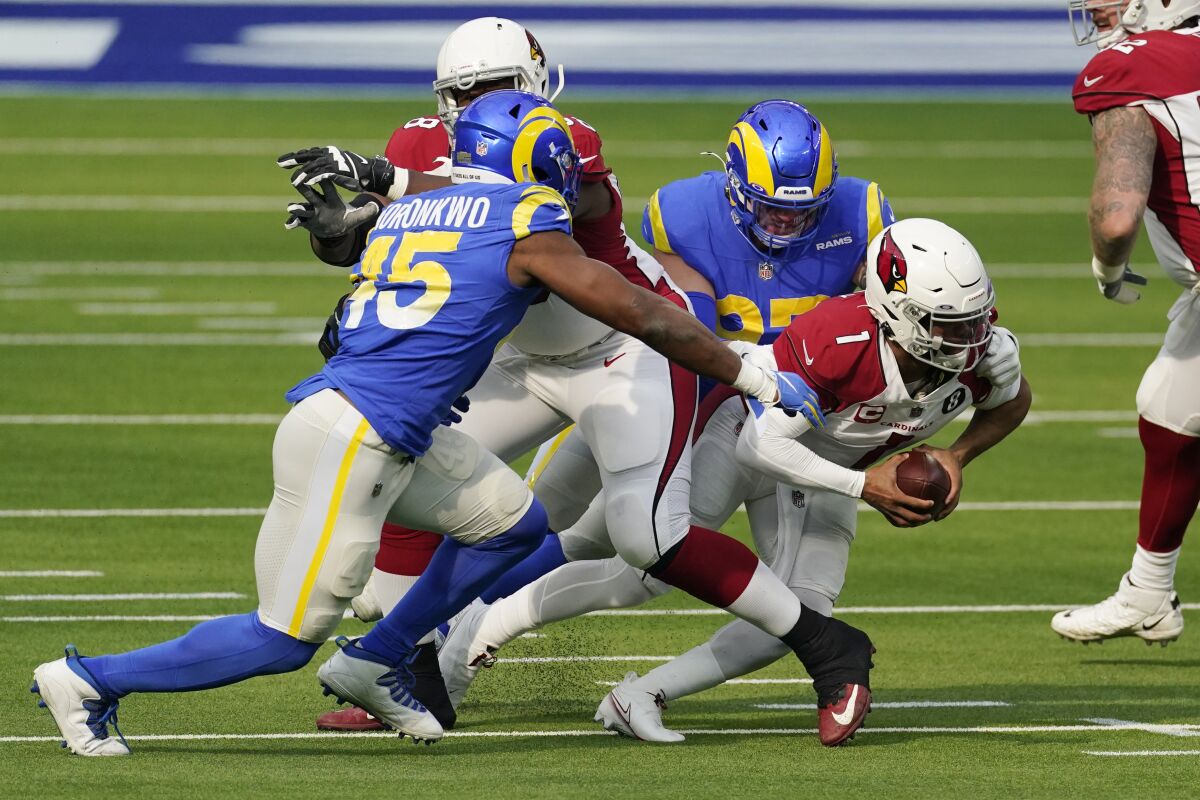Arizona Cardinals quarterback Kyler Murray (1) is sacked by Los Angeles Rams defensive end Morgan Fox during the first half of an NFL football game Sunday, Jan. 3, 2021, in Inglewood, Calif. (AP Photo/Ashley Landis)