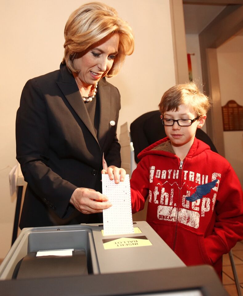 Mayoral candidate Wendy Greuel casts her ballot with her son Thomas, 7, at a Studio City polling location.