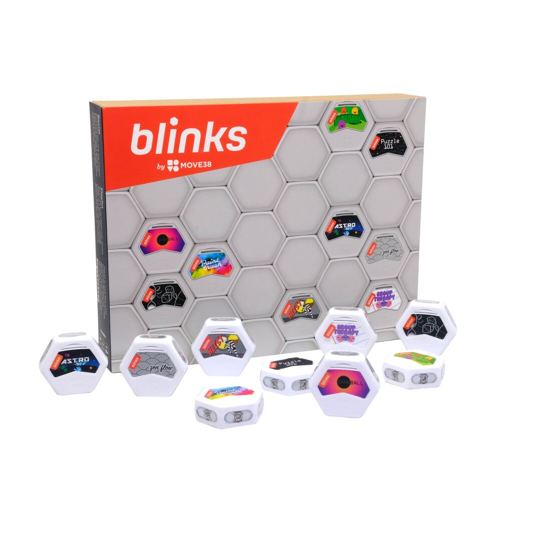 The box for Move 38's game Blinks and separate hexagonal pieces.