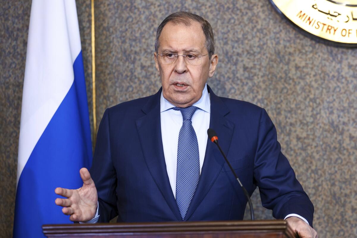 A man in a suit at a podium 