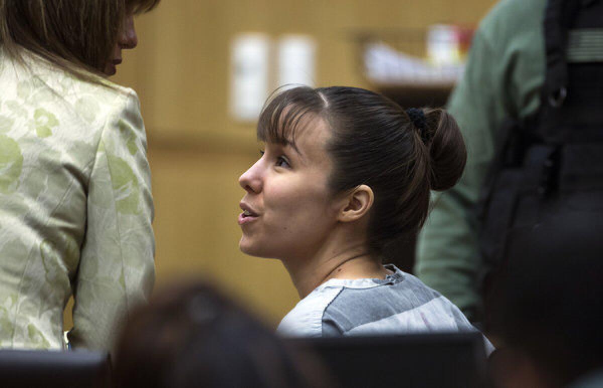 Jodi Arias talks with a defense attorney during a hearing in July.