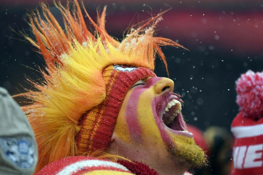 A Kansas City Chiefs fan yells in the stands during the first half of an NFL divisional football playoff game against the Indianapolis Colts in Kansas City, Mo., Saturday, Jan. 12, 2019. (AP Photo/Ed Zurga)