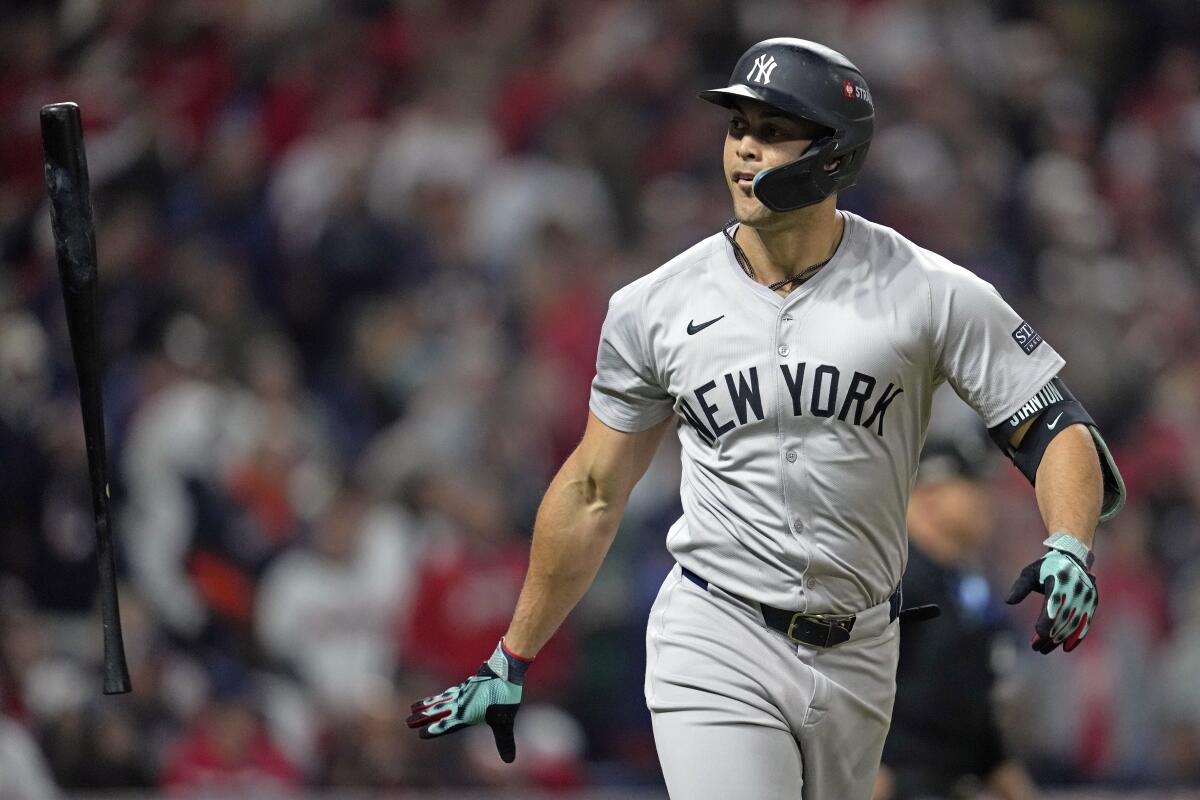 The Yankees' Giancarlo Stanton tosses his bat.